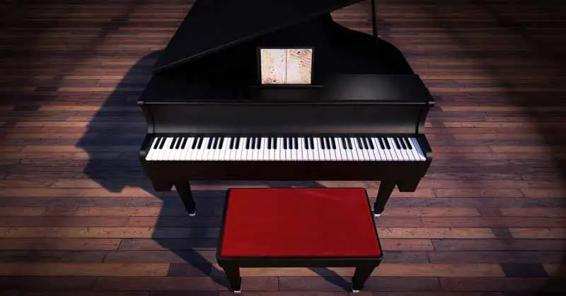 Piano and stool standing on wooden floor