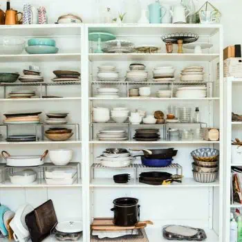 Shelves full of old kitchen items and other clutter