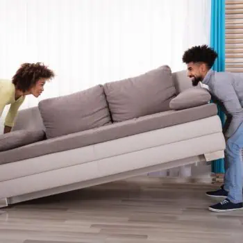 young friends moving couch