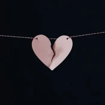 Broken paper heart on a string